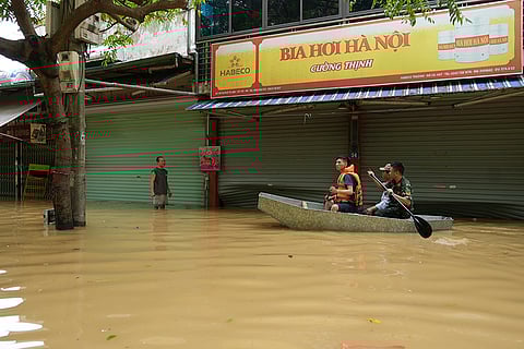 Vietnam Typhoon Yagi: Rescue officers carry people on boat in Hanoi